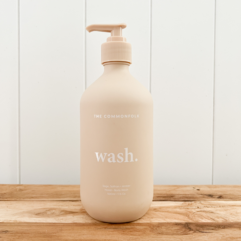 Pump bottle of The Commonfolk Collective natural hand and body wash in a recycled nude bottle.