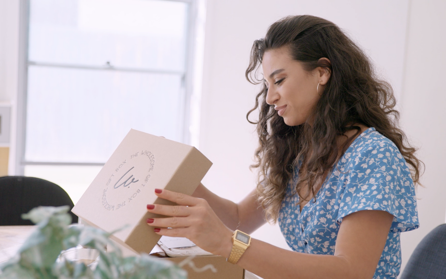 Gift recipient opening a gift box that was delivered with Sunshine Coast same day gift delivery