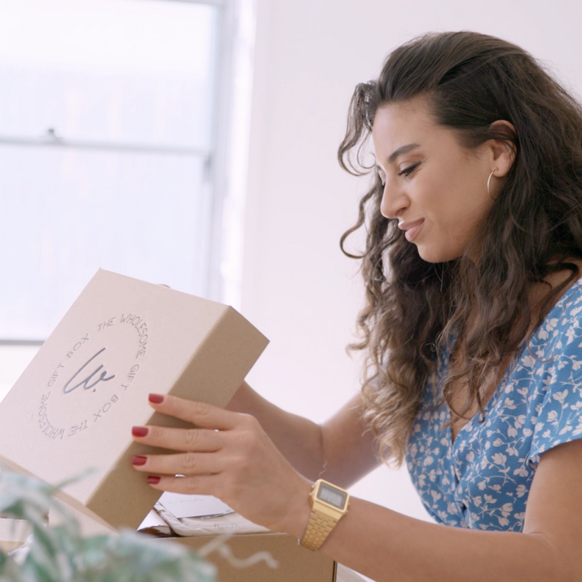 Lady receiving a gift through Sunshine Coast same day gift delivery service. 